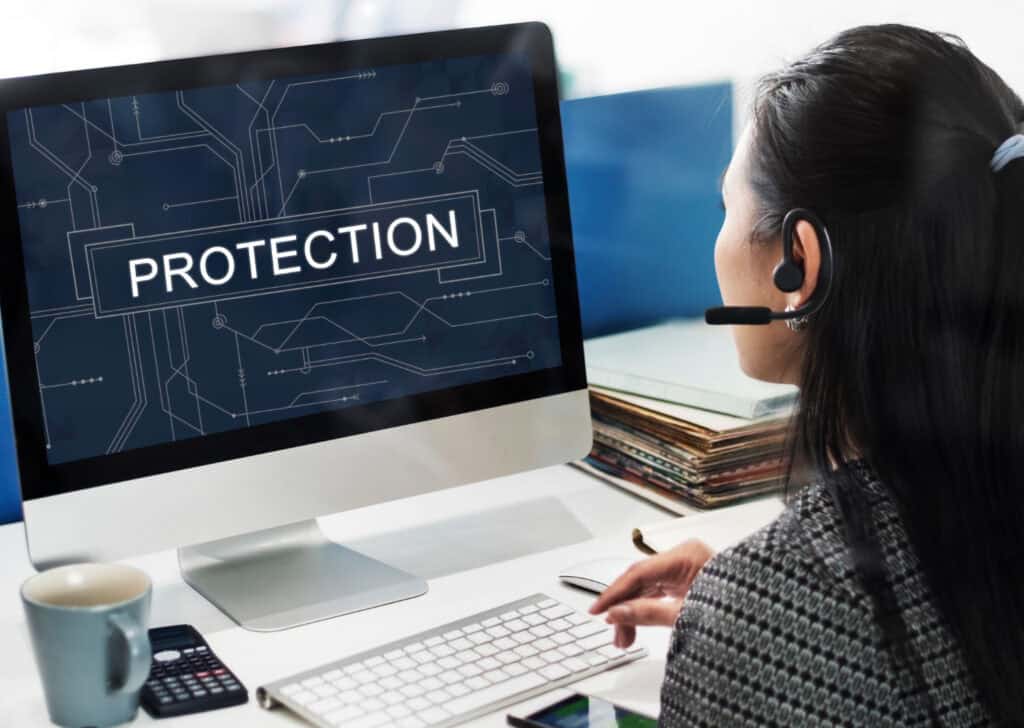 A business professional managing endpoint protection on a cloud-based security platform.