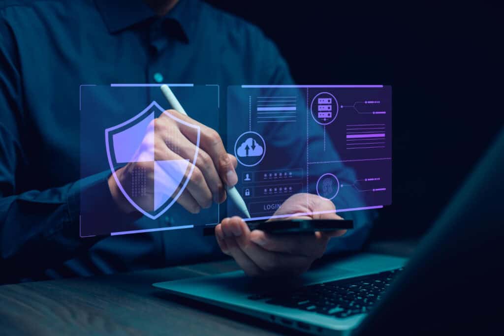 A cybersecurity expert conducting a cyber security assessment for a small business, reviewing network vulnerabilities on a laptop screen.