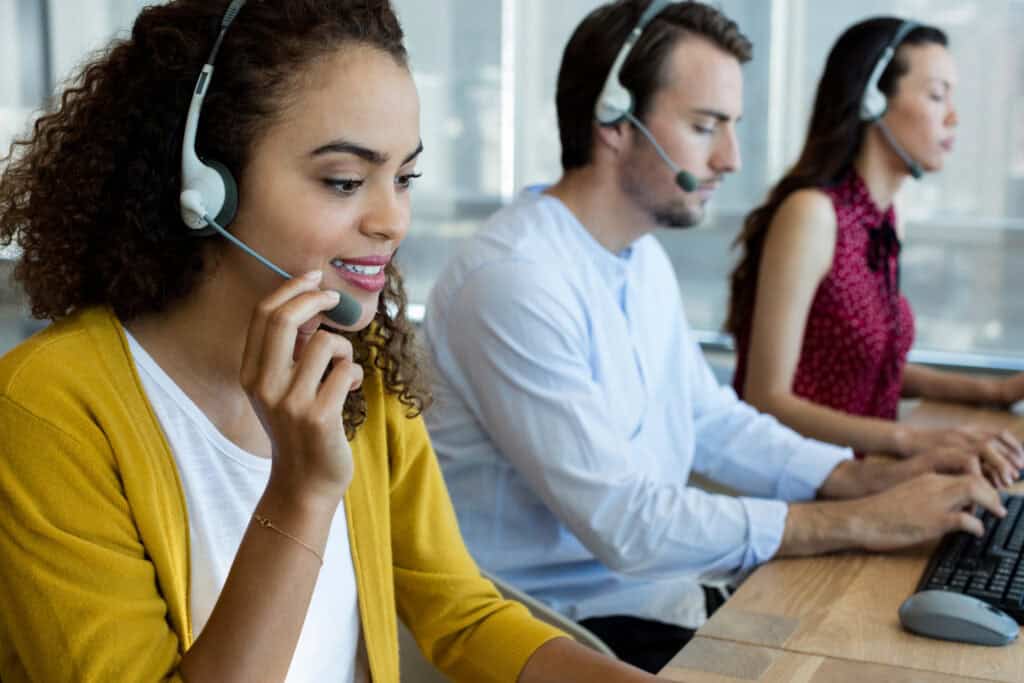 A professional call center agent providing outsourced call center services for an e-commerce business using advanced call routing and CRM integration.
